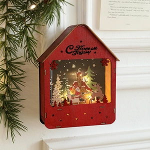 Luminous Christmas wooden house with red roof and laser-cut festive reindeer scene