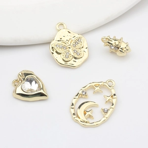 Golden alloy charms featuring heart, butterfly, star, and crown motifs with rhinestones