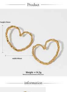 Detailed view of 316L gold stainless steel heart earrings with textured hammer finish