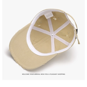 Inside view of khaki cotton baseball cap showing 100% cotton label and cross reinforcement