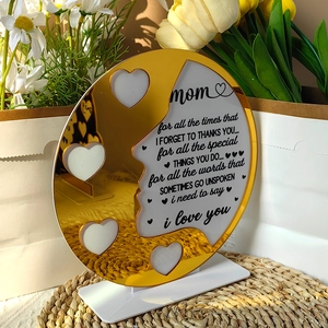 Detailed view of heart-shaped photo slots on acrylic Mother's Day plaque with gold mirror finish