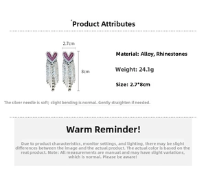 Detailed view of silver heart earrings with purple rhinestones and long tassels