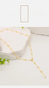 Detail of 18k gold plated long Y-shaped necklace with natural freshwater pearls on stone