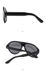 Detail view of black oversized aviator sunglasses showing side and back profiles