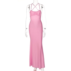 Detail of pink bodycon maxi dress featuring criss-cross straps and pleated bust texture