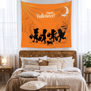 Detail of Halloween tapestry with black silhouettes of trick-or-treaters on orange background