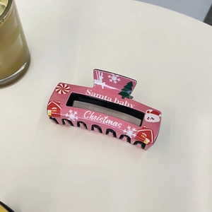 Pink Christmas hair claw clip with snowflake and Santa patterns for women