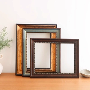 Vintage European style picture frames with ornate gold detailing and beaded relief finish