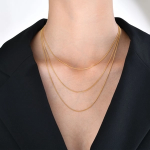 Three-layer 18k gold plated stainless steel snake chain necklace set worn by model