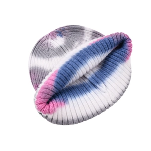 Close-up of tie-dye beanie featuring ribbed knit texture and soft winter gradient colors