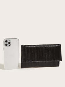 Detail of black pleated evening clutch bag compared to a smartphone for size reference