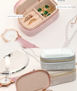 Detail of velvet jewelry box featuring wave ring slots and adjustable dividers