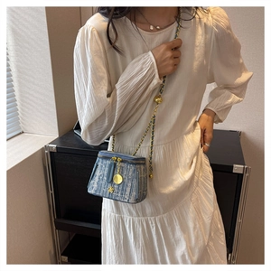 Mini blue tweed crossbody bag with gold chain strap and floral zipper charm for women
