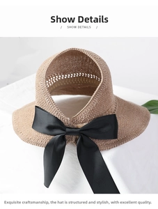Detail showing straw sun hat texture and elegant black ribbon bow decoration