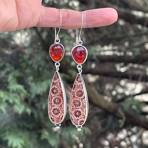 Long asymmetrical earrings with deep red rhinestones and teardrop coral pattern pendants