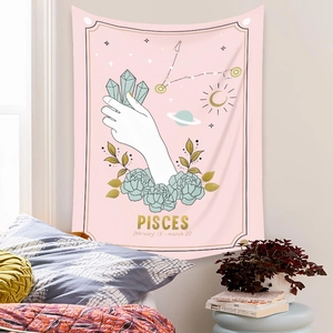 Detailed view of bohemian Pisces astrology tapestry hanging on a cozy bedroom wall