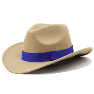 Detailed close-up of khaki western cowboy hat featuring a bright blue ribbon band decoration