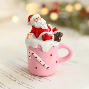 Festive Santa Claus resin figurine in a cup base for Christmas tabletop decoration