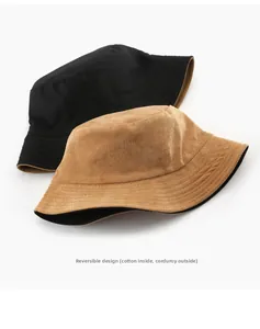 Detail of reversible bucket hat showing corduroy texture and cotton lining in two colors