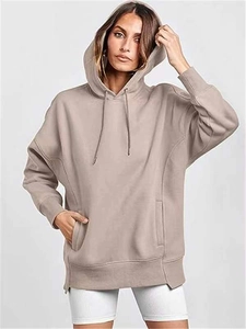 Oversized taupe hoodie detail featuring drop shoulders and large kangaroo pocket