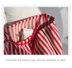 Detail view of large capacity red and white striped canvas tote bag interior space