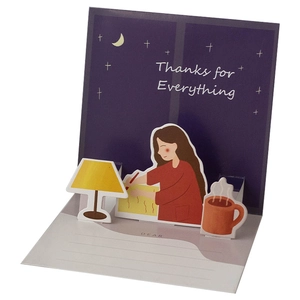 3D pop-up teacher appreciation card with hand-drawn girl writing under a lamp