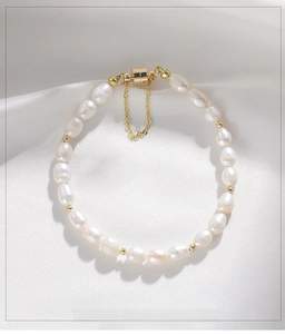 Detail of freshwater pearl bracelet with gold beads and a secure magnetic clasp