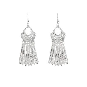Detail of silver ethnic drop earrings featuring hollow leaf patterns and long tassels