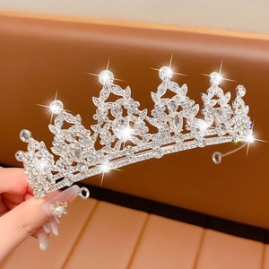 Close-up of sparkling silver rhinestone crown with intricate pear-cut crystals for events