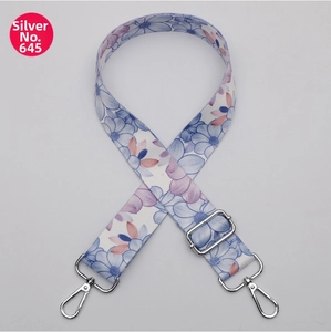 Detail of floral patterned wide replacement strap with silver metal swivel hooks