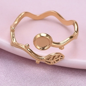 Detailed close-up of rose gold leaf-shaped open ring with intricate vein textures