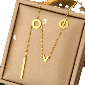 Elegant gold Y-shaped LOVE letter necklace with pearls and high-polish finish on jewelry box