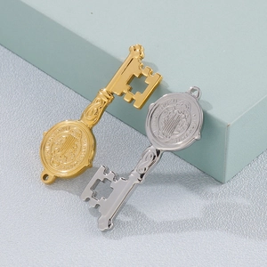 Vintage gold and silver key pendants with Saint Benedict religious embossed cross patterns
