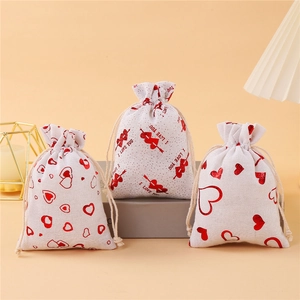 Linen wedding favor bags with red heart patterns and I LOVE YOU gold foil prints