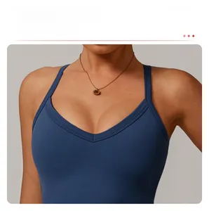 Macro shot of the deep V-neckline and fine straps on this dark blue athletic yoga top