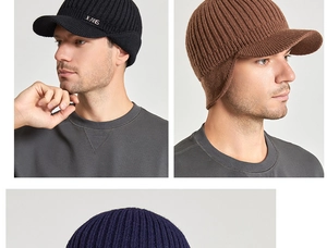 Close-up of winter knit newsboy hat with ear flaps in black and brown ribbed fabric