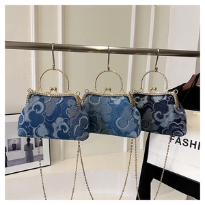 Three denim jacquard bags with auspicious cloud patterns and rhinestone handles on display