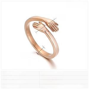 Macro view of rose gold stainless steel hug ring showing detailed texture and 2mm band