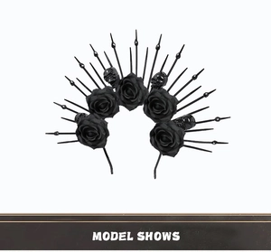 Detailed view of Gothic queen headband with black silk roses and skull studs