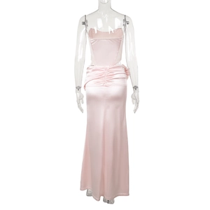 Detail view of pink satin evening dress showing the ruched back design and silhouette