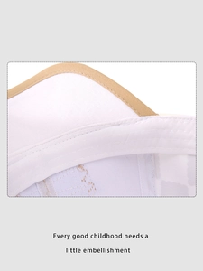 Close-up of durable white canvas baseball cap with fine stitching and yellow piping details