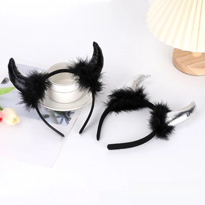 Detail of red and silver devil horn headbands with black feathers for Halloween parties