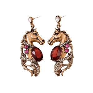 Vintage gold horse-head earrings with red oval gemstones and sparkling accents