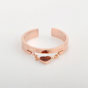 Rose gold heart pendant ring with Roman numerals and chain link on a white background