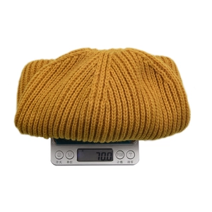Winter unisex knitted beanie in yellow ribbed knit fabric weighing 70g for warmth