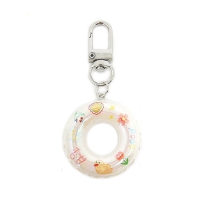 Macro detail of holographic mini swim ring keychain with colorful duck and flower motifs