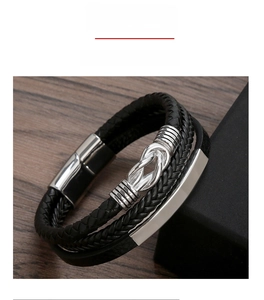 Macro detail of multi-layer woven leather bracelet with silver magnetic metal clasp