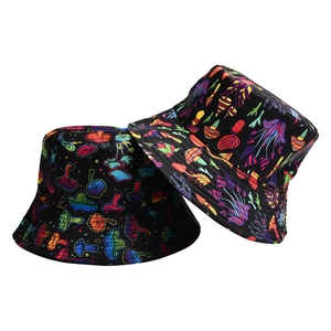 Detail of two black bucket hats with colorful psychedelic mushroom prints on a white background