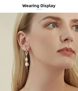 Close-up of a model wearing French vintage knot earrings with natural pearls