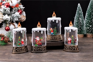 Close-up of four assorted Christmas lighted water candles with festive Santa scenes